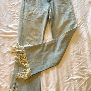 zara fringe, light-wash, low-rise jeans. slit at bottom.